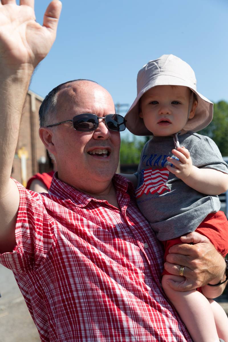 Batavia resident waving to parade travelers